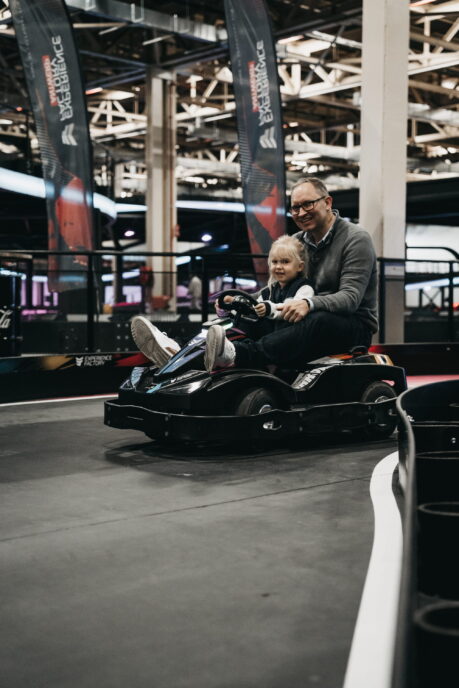Mini karting at Experience Factory: A young racer and adult.